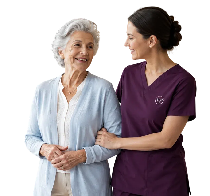 A Vivo Healthcare caregiver in purple scrubs walking arm-in-arm with a smiling senior resident in a light blue cardigan